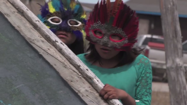 Photo of two girls in Attawapiskat involved in the earlier Kiskenamahagewin (The Way of Learning) project by Jackie Hookimaw-Witt.